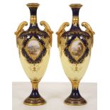 A PAIR OF COALPORT TWIN-HANDLED VASES, circa 1896, both finely painted with medallions depicting