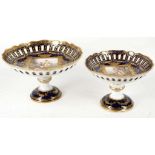 TWO VIENNA STYLE COMPORTS, late 19th century, both with scalloped and pierced rims, the larger