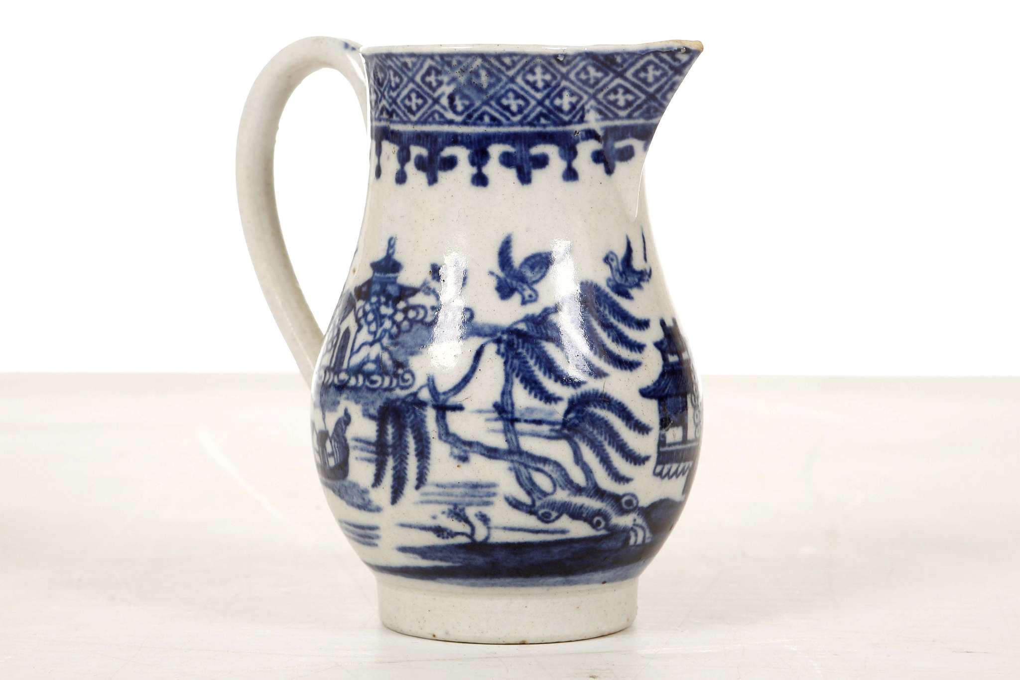 A RARE AND UNUSUAL ENGLISH CREAM JUG, 18th century, possibly Liverpool, of sparrow beak form with