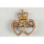 A Victorian 15ct gold double heart pendant brooch, set with diamonds and seed pearls