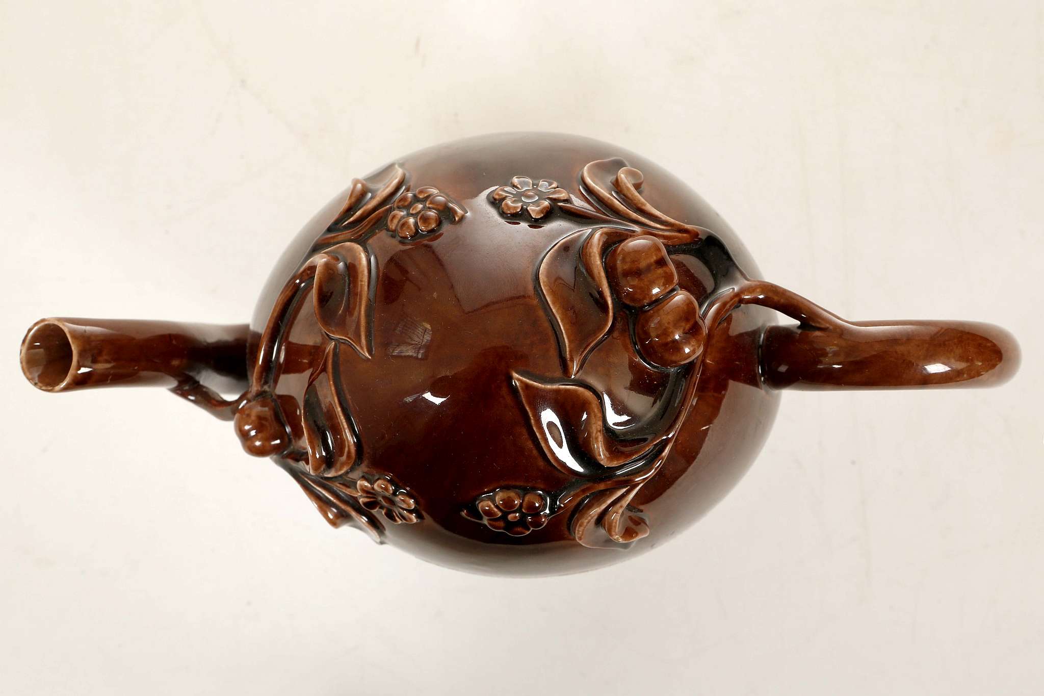 A BRAMELD CADOGAN TREACLE-GLAZE TEAPOT, circa 1810-30, the ovoid body applied with peaches, - Image 3 of 4