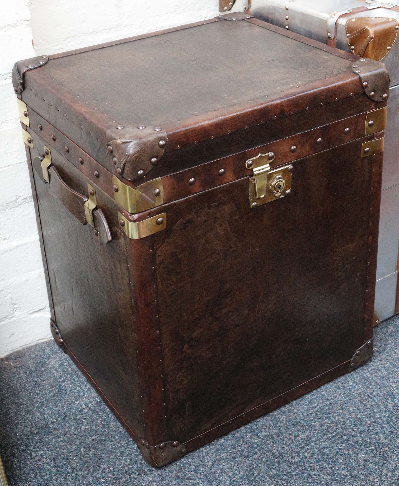 A pair of leather clad trunks, 55 h x 46cm wide (2)