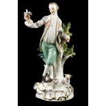 A MEISSEN FIGURE OF A SHEPHERD, early 20th century, modelled as a young man leaning on a leafy tree,