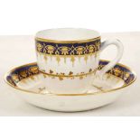 A CAUGHLEY CUP AND SAUCER, circa 1795, decorated with a foliate band in gold within a formal