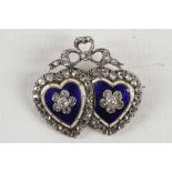 A Victorian gold, diamond and enamel double heart brooch