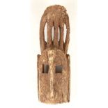 A DOGON WOOD MASK, MALI Of the ‘gomintogo’ type, 55cm high Provenance: purchased from Galerie Mame