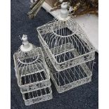 Two cream painted bird cages