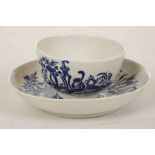 A WORCESTER TEABOWL AND SAUCER, circa 1780, decorated in blue with the 'Mother and Child' pattern,