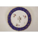 A DERBY PLATE, circa 1775, painted with an urn hung with a garland of flowers, surrounded by