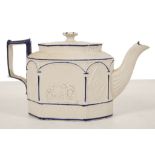 A CASTLEFORD TYPE TEAPOT AND COVER, circa 1800, relief moulded on one side with classical figures