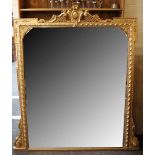 A 19th or 20th century overmantle mirror, with shield surmount leaf and ribbon border, 144cm wide