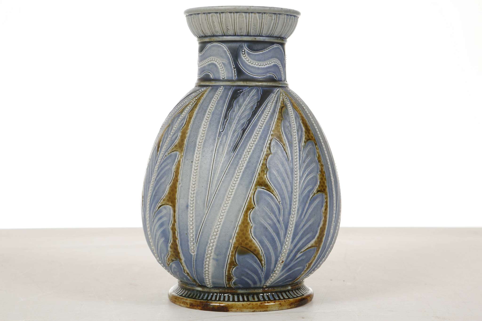 FRANK BUTLER FOR DOULTON LAMBETH, an ovoid vase, dated 1876, incised with stylised leaf decoration