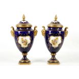 A FINE PAIR OF COALPORT TWIN-HANDLED VASES AND COVERS, circa 1896, both painted with a fancy bird