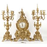 A reproduction gilt metal clock garniture in Louis XV style