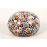 A GOOD BACCARAT CLOSE-PACKED MILLEFIORI PAPERWEIGHT, dated 1848, inset with an assortment of