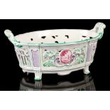 AN EMILLE GALLÉ FAIENCE BASKET, circa 1900, the oval form with pierced sides and scroll handles,