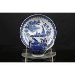 A WORCESTER COFFEE CUP AND SAUCER, circa 1770, printed in blue with 'The Fisherman and Cormorant'