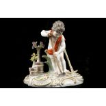 A MEISSEN FIGURE OF A PUTTO GARDENER, late 19th century, after the model by Kändler, emblematic