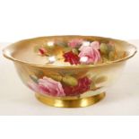 A ROYAL WORCESTER BOWL, dated 1927, finely painted with roses by Walter Sedgley (23.1cm diameter),