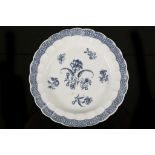 A CAUGHLEY PLATE, circa 1780, printed in blue with the 'Gillyflower' pattern, the scalloped rim with