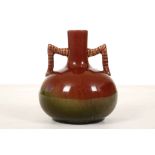 CHRISTOPHER DRESSER FOR LINTHORPE, a twin-handled bottle vase, circa 1885, of globular form with a