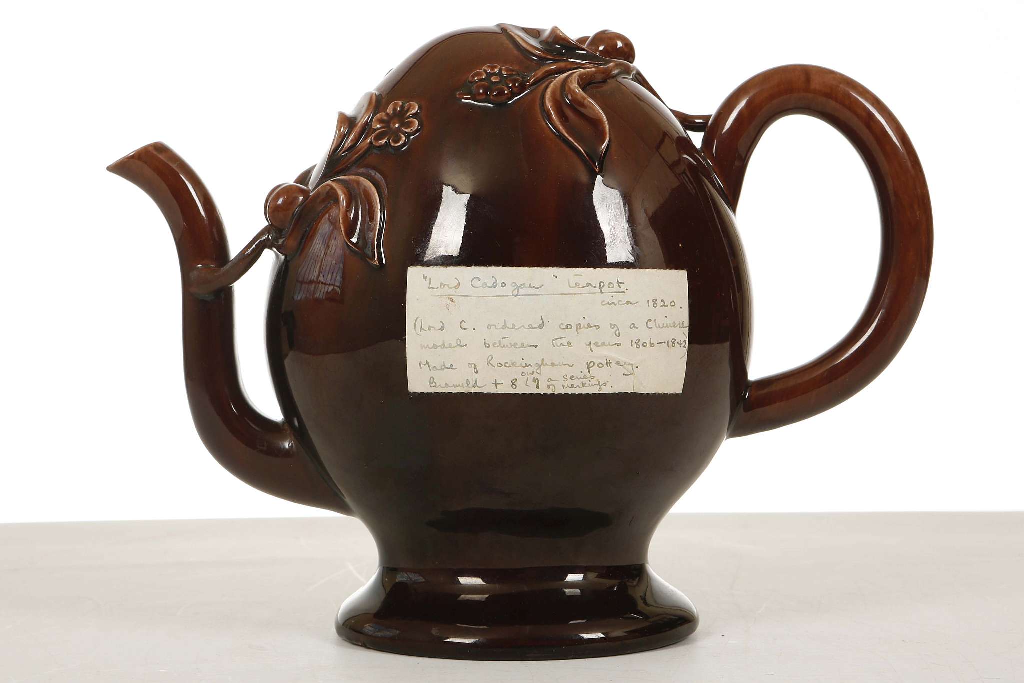 A BRAMELD CADOGAN TREACLE-GLAZE TEAPOT, circa 1810-30, the ovoid body applied with peaches, - Image 2 of 4