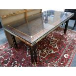 A Roman Deco dining table and eight chairs, designed by Paolo Barachia in ebonised and padouk wood