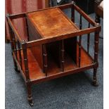 A late 19th Century mahogany Canterbury on ring turned supports, on ring turned legs