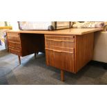 A teak 1970's office desk of Danish style, 183cm wide