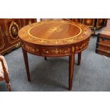 A circular mahogany and marquetry inlaid table with deep frieze with drawers, raised on square