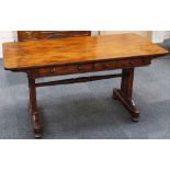 A 19th Century rosewood library table with two frieze drawers, raised on style ends with platform