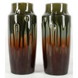 A pair of continental studio glazed vases in the manner of Christopher Dresser, 27.5cm high