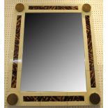 A faux ivory and tortoiseshell framed wall mirror, with gilt corner roundels