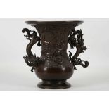 A Japanese bronze dragon base, Meiji period (1868-1912), decorated with scrolling clouds with ornate