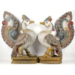 A pair of antique Indian carved, woodland polychrome 'Persian' peacocks, 76cm high (2)