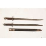 Two WWI British Army bayonets, both with regimental markings, Wilkinson 1907 with leather scabbard