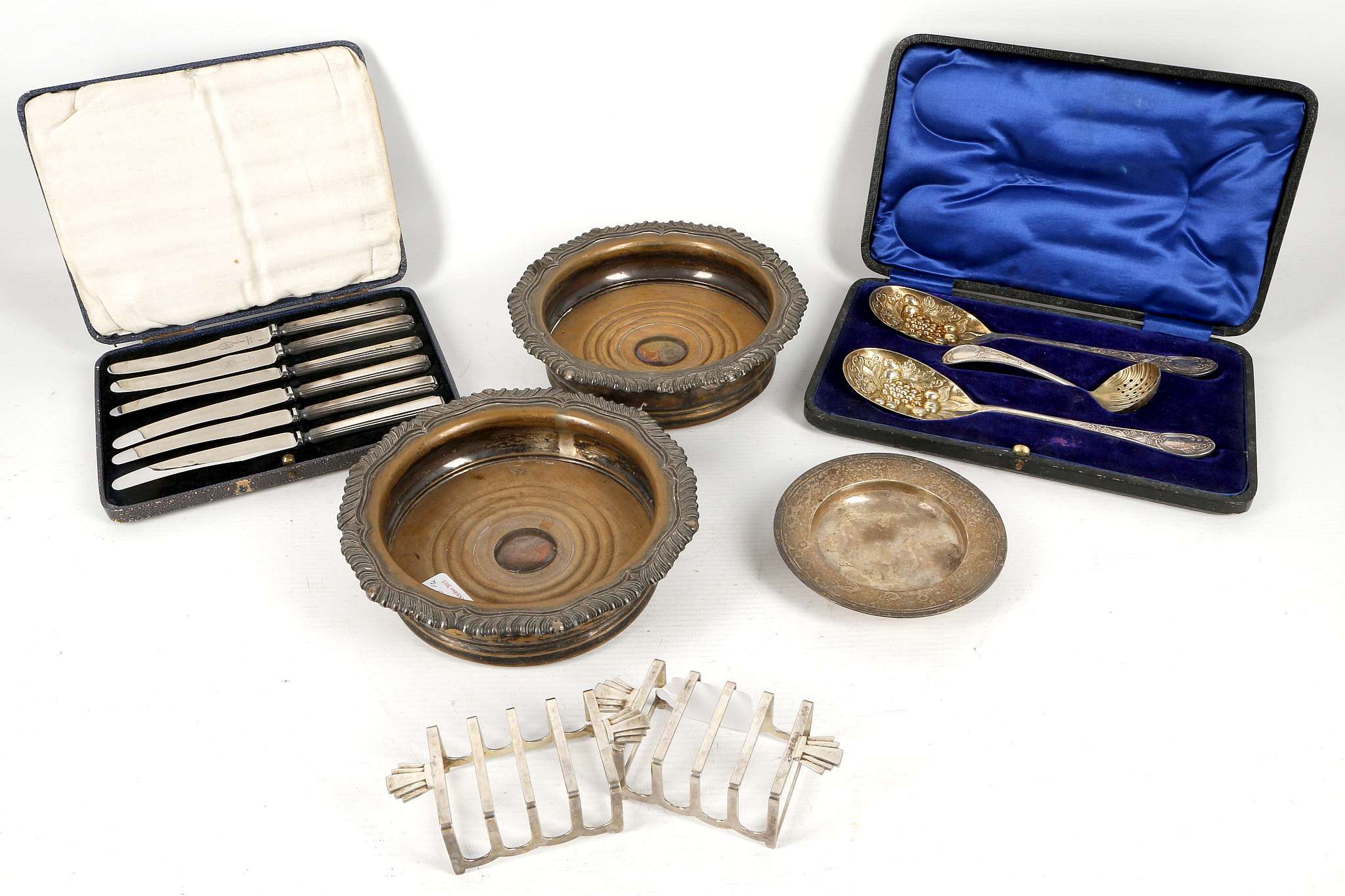 A collection of hallmarked silver, including a pair of toast racks, a pin dish and a boxed set of