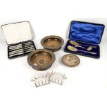 A collection of hallmarked silver, including a pair of toast racks, a pin dish and a boxed set of
