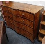 An unusual campher wood lined satin bow front chest of two short and three long drawers, on bun