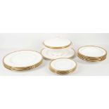 A collection of Wedgwood Senator gilt-decorated dinnerware with gilt trailing leaf decoration,