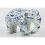 A Chinese blue and white porcelain model of an elephant, the body decorated with dragons chasing