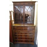 A Georgian mahogany secretaire bookcase, the upper section with ogee pediment, over astragel