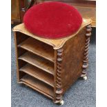 An unusual walnut musical manuscript storage / piano stool with upholstered circular seat over the