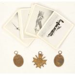 WWII Nazi 3rd Reich medals; War Merit cross, two West Wall medals and collectors cards, images of