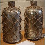 Two large contemporary wine vessels with mesh webbing and a distressed finish, 'Favon Maitre De Vin'