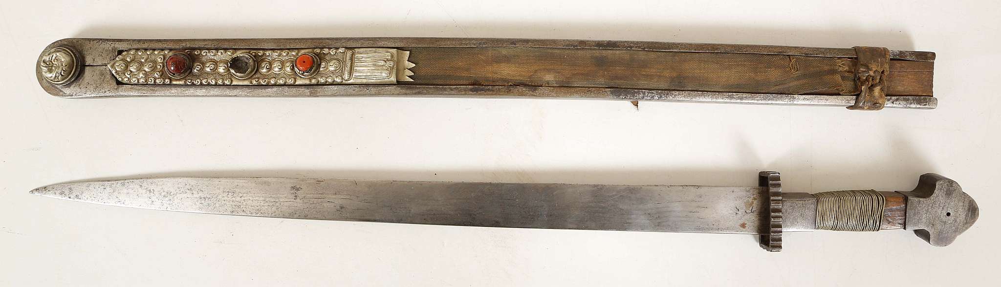 Late 18th / early 19th Century Tibetan sword, gun metal pommel, wire bound grip, gun metal collet,