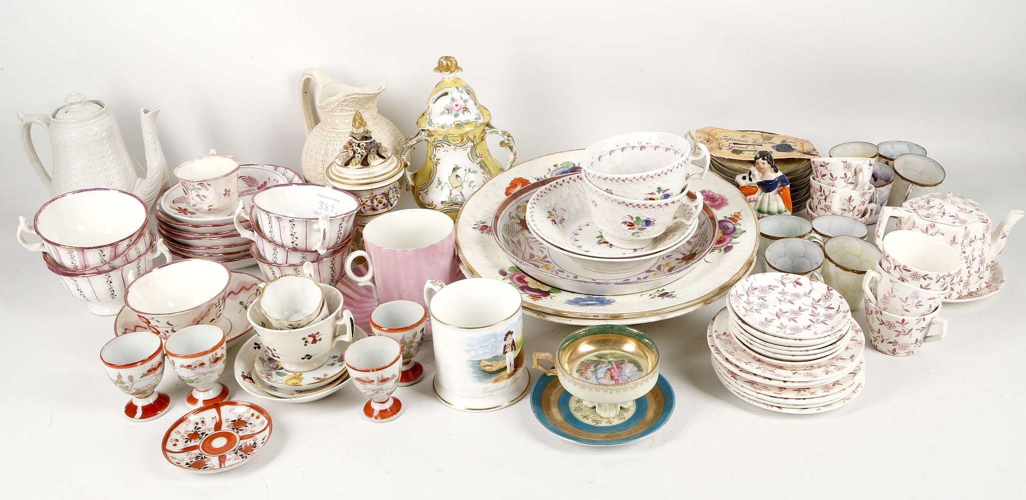 An interesting collection of ceramics, including lustre cups and saucers, a pair of Coalport