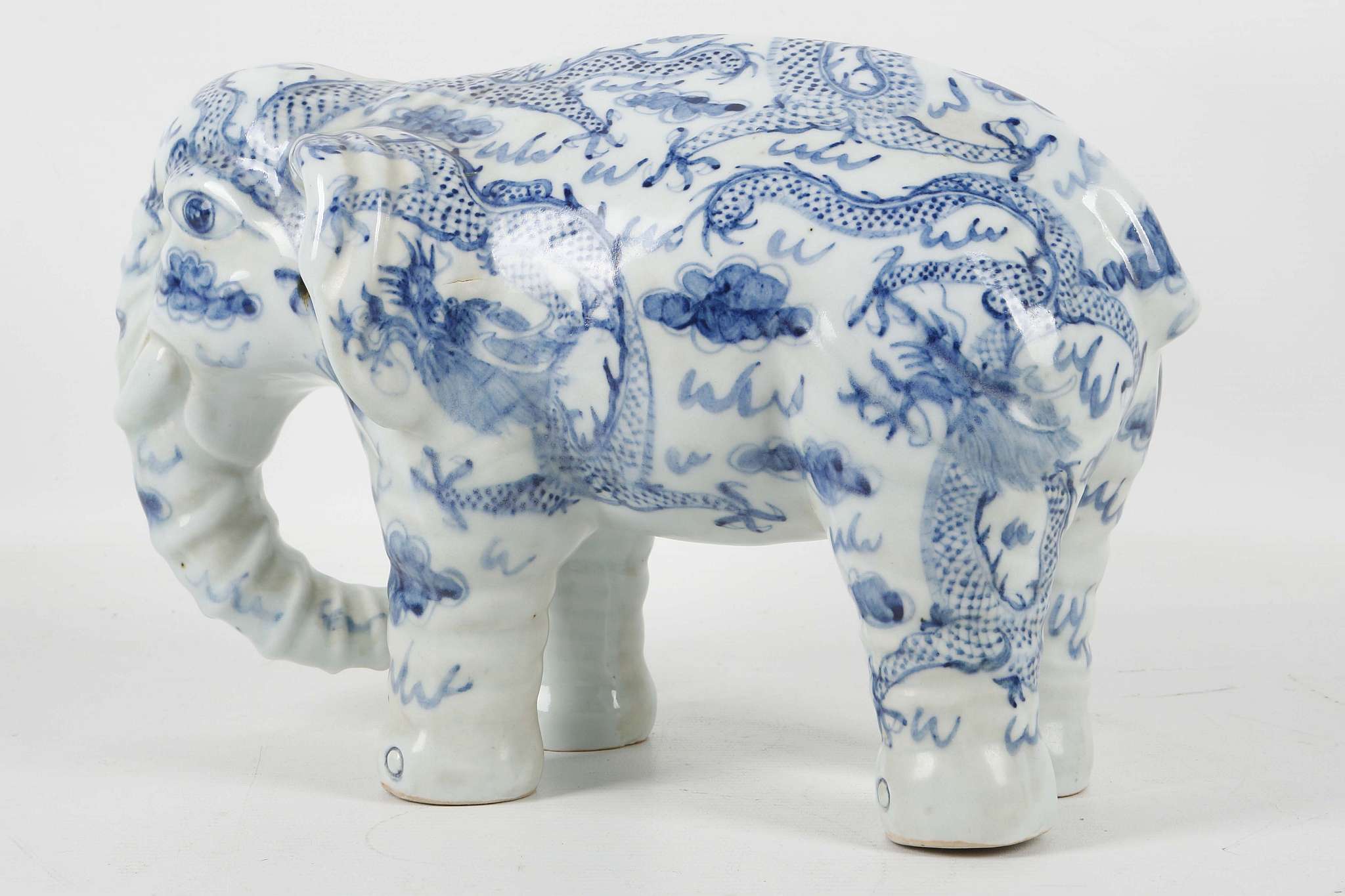 A Chinese blue and white porcelain model of an elephant, the body decorated with dragons chasing - Image 2 of 3