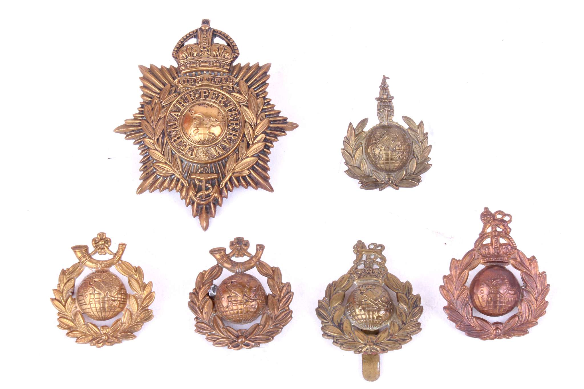 Royal Marines helmet plate & other Marine badges together with British Army military cap badges;