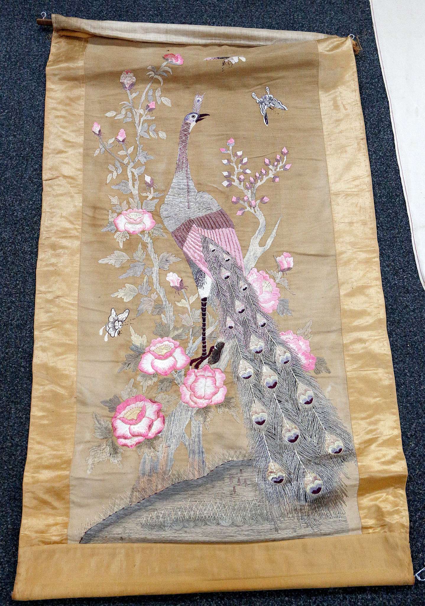 An early 20th Century Chinese silk embroidered panel with peacock surrounded by peonies, 185 x - Image 2 of 4